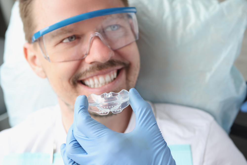 Dentist,Tries,On,Transparent,Mouthguard,To,Correct,Bite,And,Bruxism